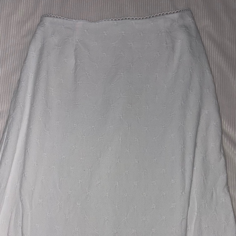 White maxi skirt with floral detail and scalloped lace at the top